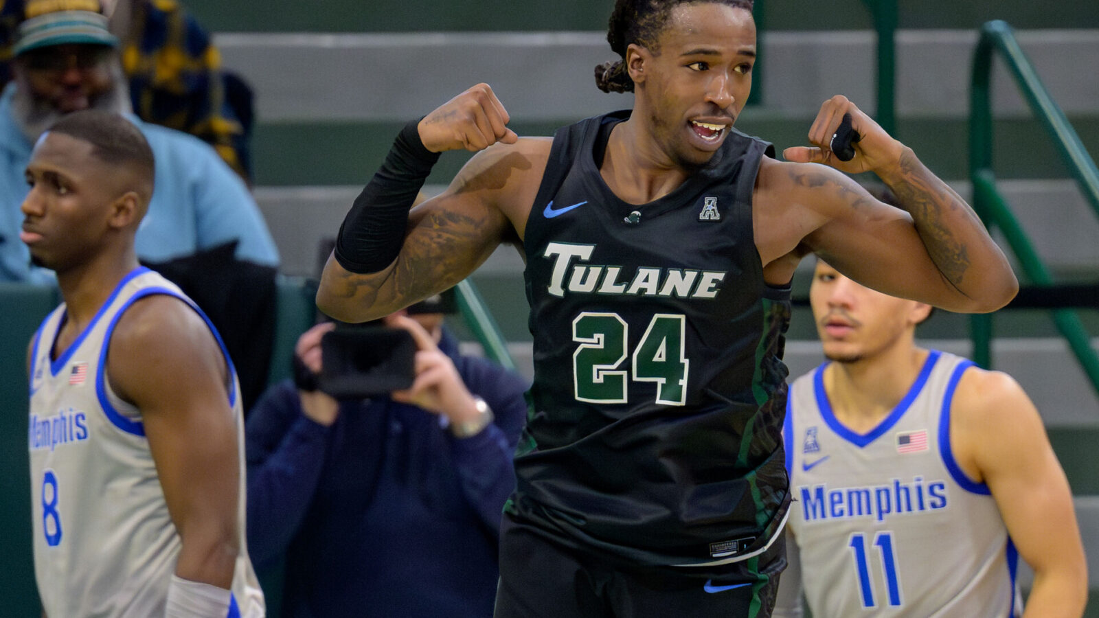 Jan 21, 2024; New Orleans, Louisiana, USA; Tulane Green Wave forward Kevin Cross (24) celebrates a score during the second half next Memphis Tigers forward David Jones (8) and guard Jahvon Quinerly (11) at Avron B. Fogelman Arena in Devlin Fieldhouse.