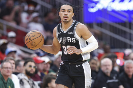 Mar 5, 2024; Houston, Texas, USA; San Antonio Spurs guard Tre Jones (33) dribbles the ball during the first quarter against the Houston Rockets at Toyota Center.