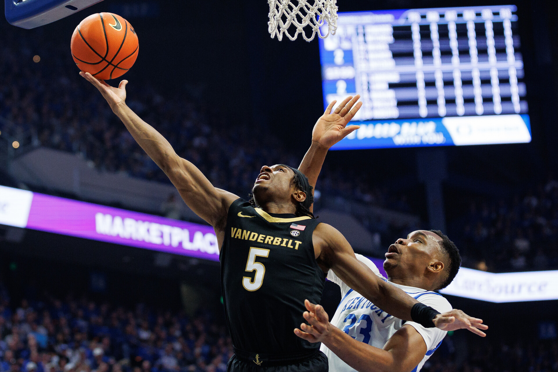 Mar 6, 2024; Lexington, Kentucky, USA; Vanderbilt Commodores guard Ezra Manjon (5) goes to the basket during the first half against the Kentucky Wildcats at Rupp Arena at Central Bank Center.