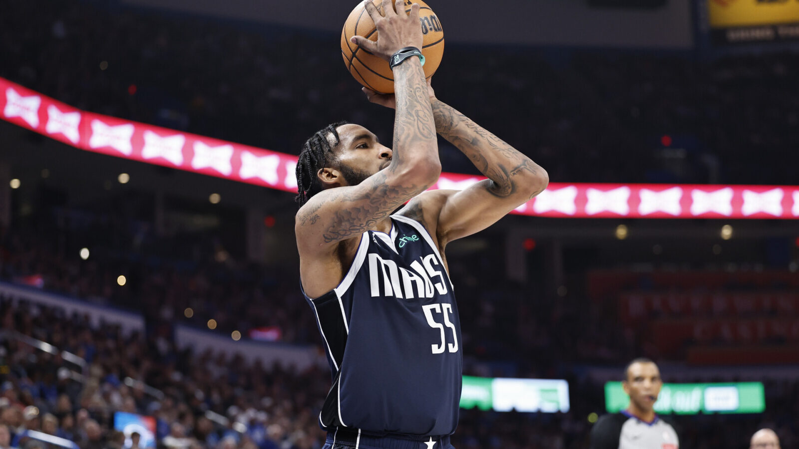 Mar 14, 2024; Oklahoma City, Oklahoma, USA; Dallas Mavericks forward Derrick Jones Jr. (55) shoots a three point basket against the Oklahoma City Thunder during the first half at Paycom Center.