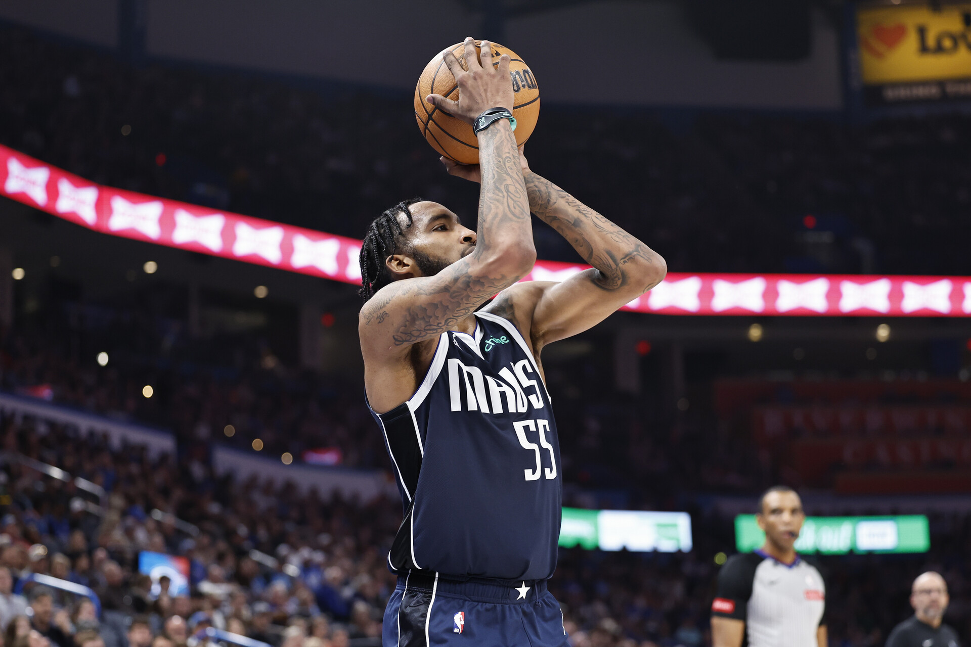 Mar 14, 2024; Oklahoma City, Oklahoma, USA; Dallas Mavericks forward Derrick Jones Jr. (55) shoots a three point basket against the Oklahoma City Thunder during the first half at Paycom Center.
