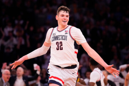 Mar 16, 2024; New York City, NY, USA; Connecticut Huskies center Donovan Clingan (32) celebrates as the clock winds down on Marquette Golden Eagles in the second half at Madison Square Garden.