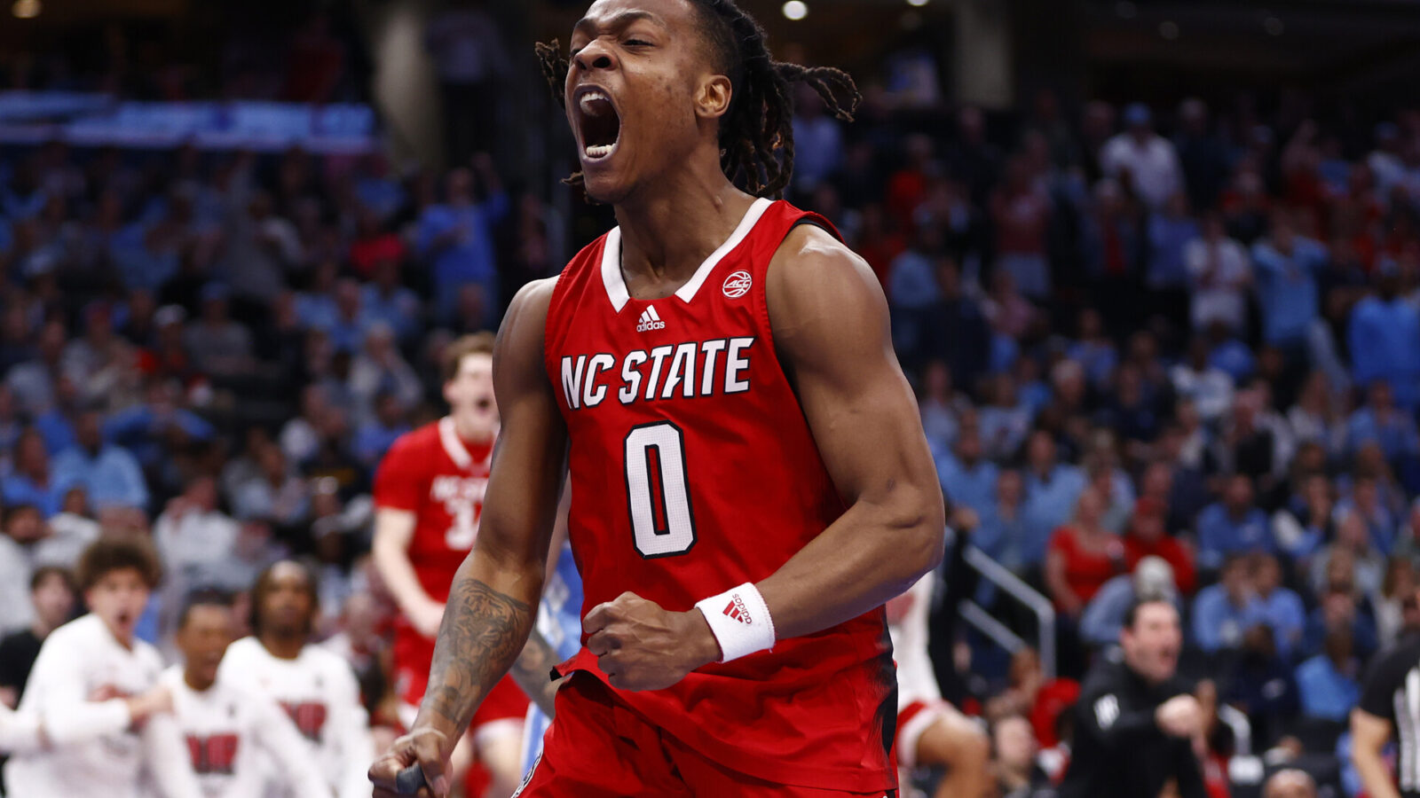Mar 16, 2024; Washington, D.C., USA; North Carolina State Wolfpack guard DJ Horne (0) reacts against the North Carolina Tar Heels during the second half at Capital One Arena.