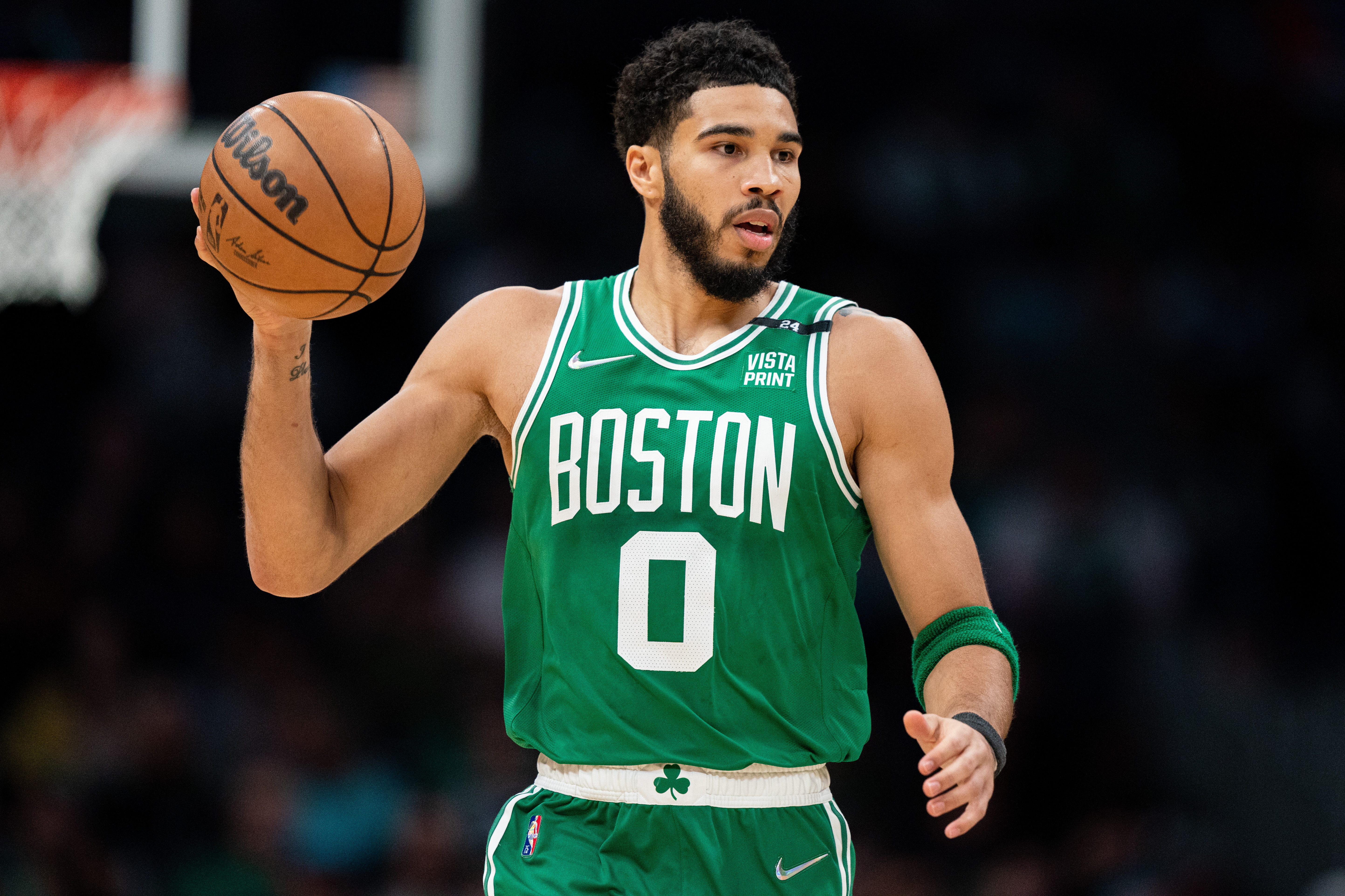 Jayson Tatum of the Boston Celtics brings the ball up court in the first quarter against the Charlotte Hornets at Spectrum Center on March 09, 2022 in Charlotte, North Carolina.