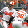 Baltimore Orioles shortstop Gunnar Henderson (2) greeted by coach Tony Mansolino (36) following his solo home run in the first inning against the Minnesota Twins at Oriole Park at Camden Yards.