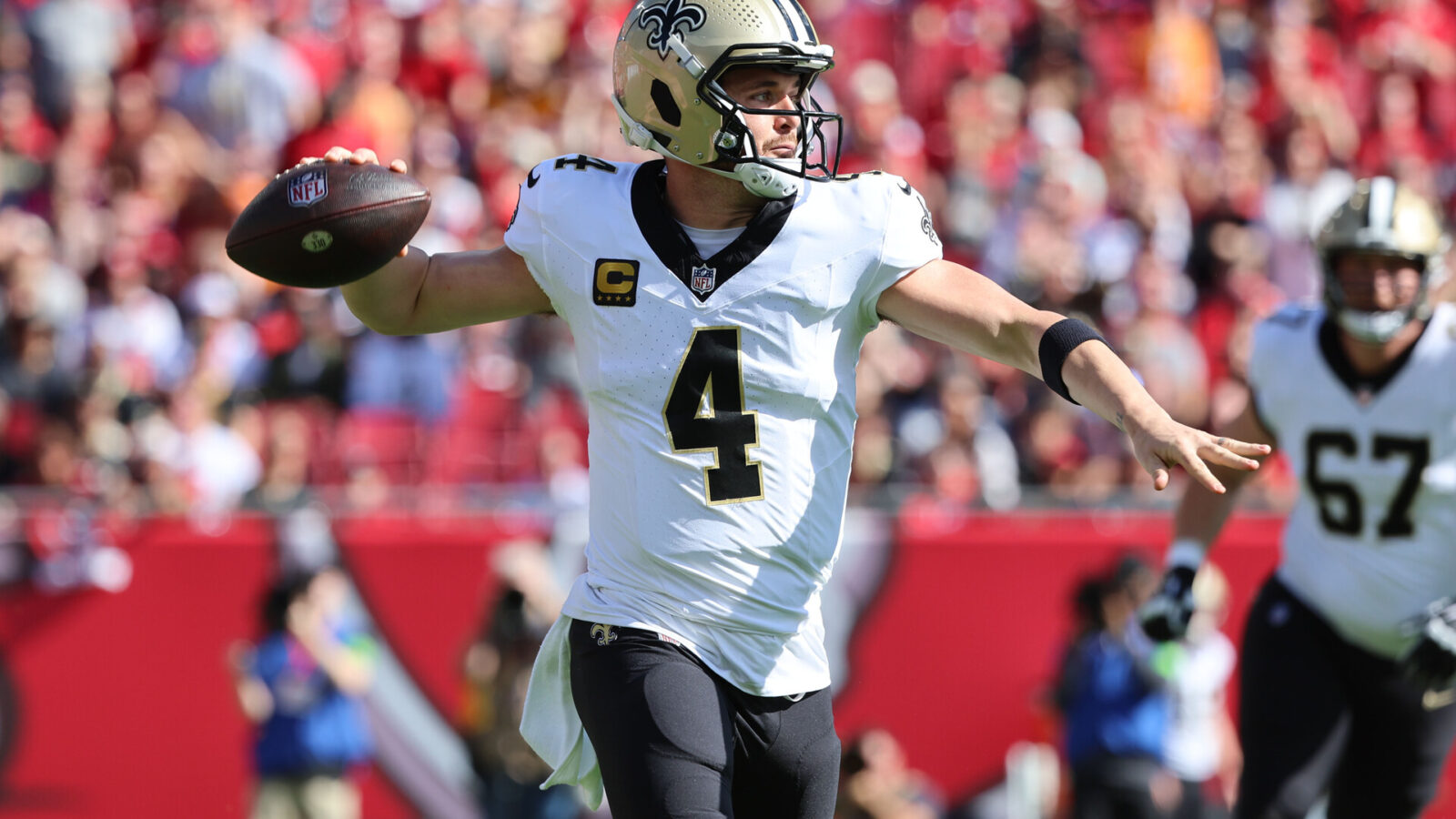 Dec 31, 2023; Tampa, Florida, USA; New Orleans Saints quarterback Derek Carr (4) throws the ball against the Tampa Bay Buccaneers during the first quarter at Raymond James Stadium.
