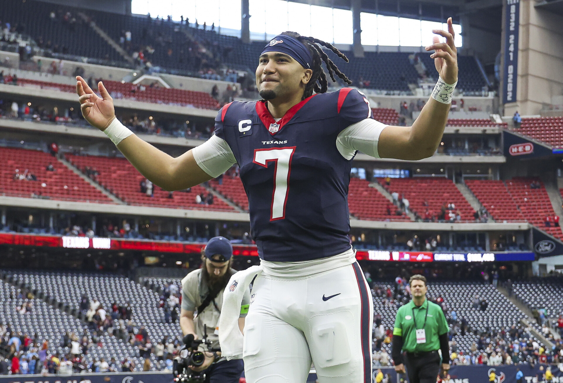 Dec 31, 2023; Houston, Texas, USA; Houston Texans quarterback C.J. Stroud (7) jogs off the field after the game against the Tennessee Titans at NRG Stadium.
