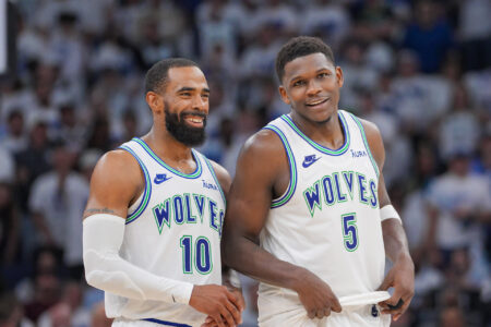 Minnesota Timberwolves guard Mike Conley (10) and guard Anthony Edwards (5) talk against the Denver Nuggets in the fourth quarter during game six of the second round for the 2024 NBA playoffs at Target Center.