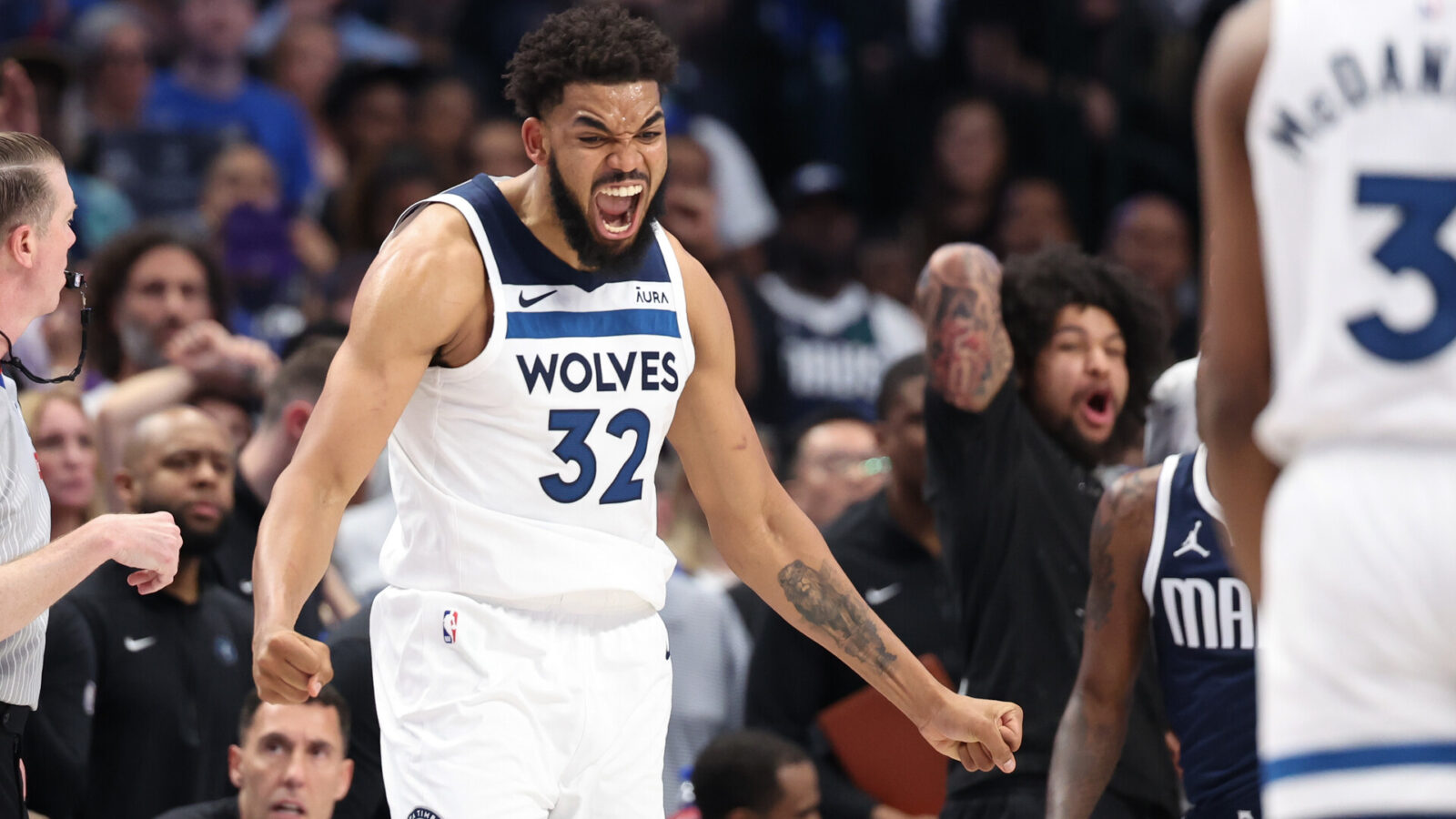 Minnesota Timberwolves center Karl-Anthony Towns (32) reacts during the fourth quarter against the Dallas Mavericks in game four of the western conference finals for the 2024 NBA playoffs at American Airlines Center.