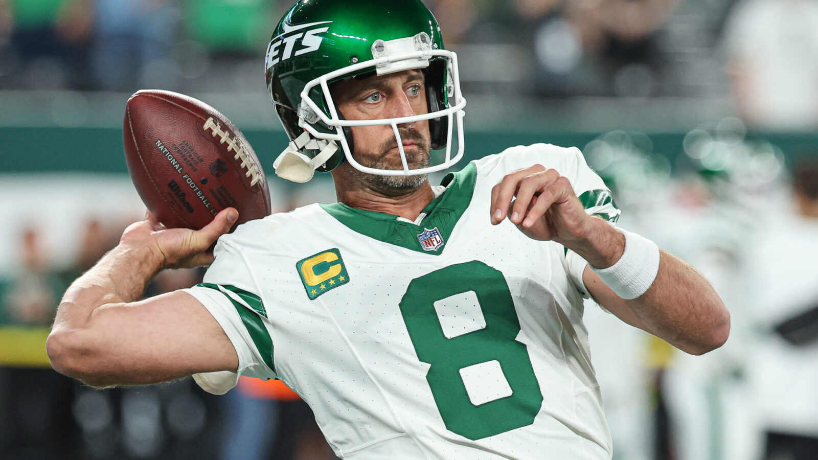 New York Jets quarterback Aaron Rodgers (8) warms up before the game against the Buffalo Bills at MetLife Stadium.
