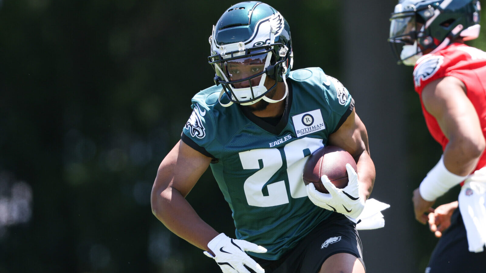 May 30, 2024; Philadelphia, PA, USA; Philadelphia Eagles running back Saquon Barkley (26) runs with the ball during practice at NovaCare Complex.