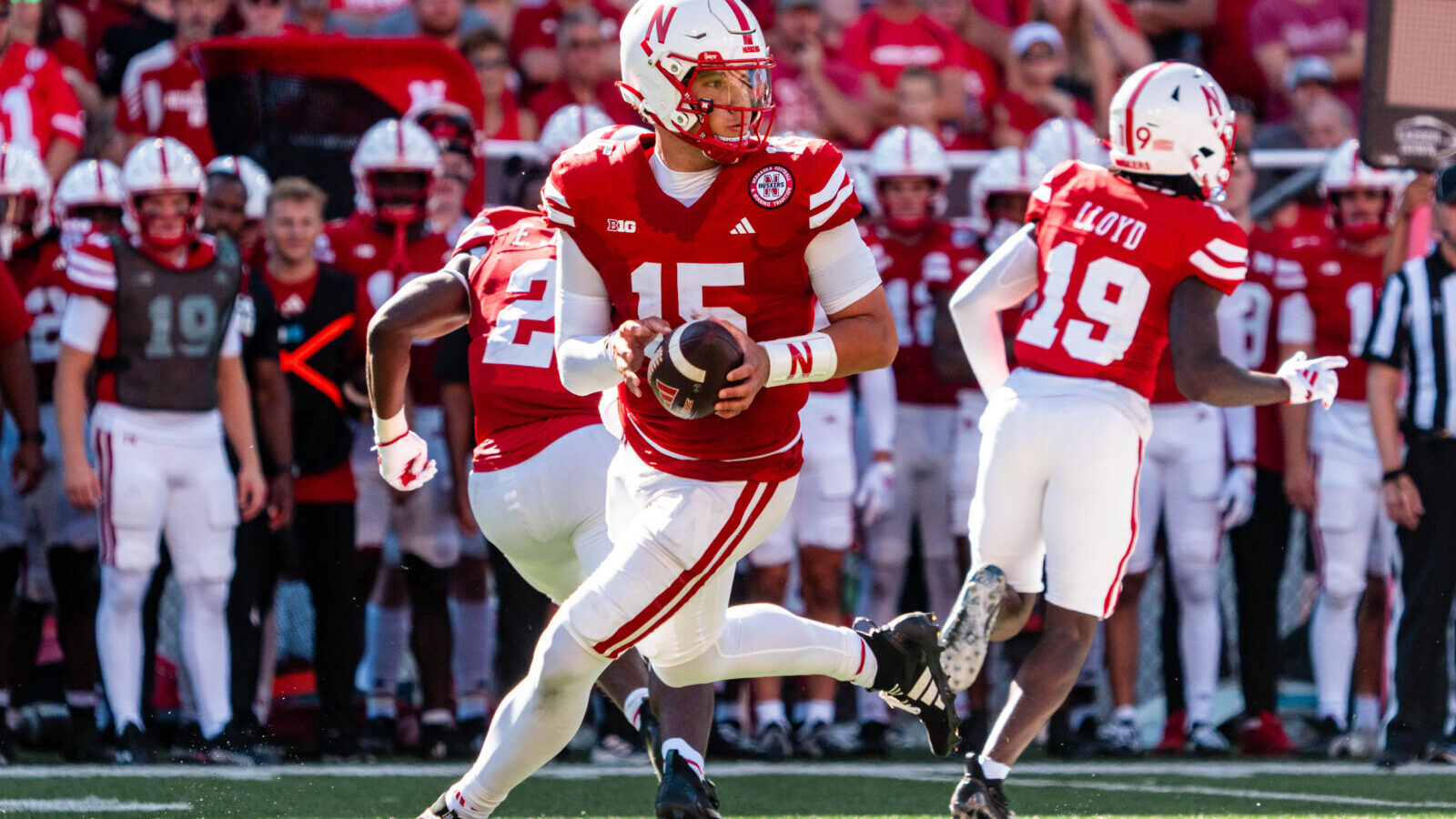 Aug 31, 2024; Lincoln, Nebraska, USA; Nebraska Cornhuskers quarterback Dylan Raiola (15) rolls out to pass against the UTEP Miners during the third quarter at Memorial Stadium.