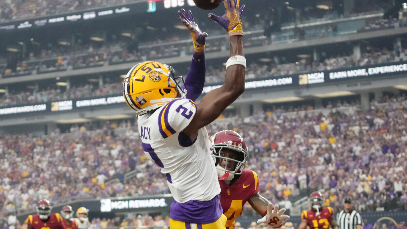 Sep 1, 2024; Paradise, Nevada, USA; LSU Tigers wide receiver Kyren Lacy (2) attempts to catch the ball against Southern California Trojans cornerback Jacobe Covington (14) at Allegiant Stadium.