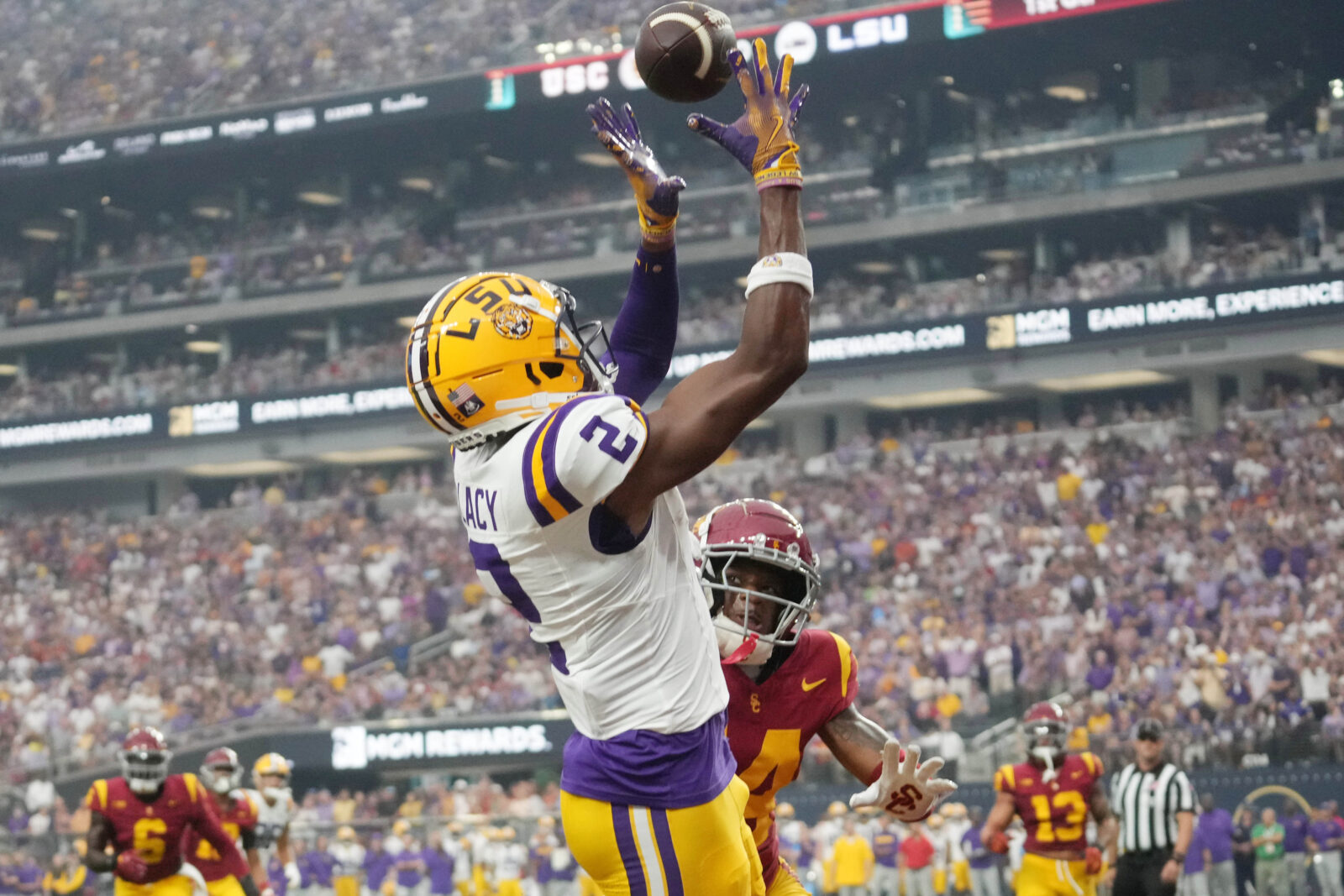 Sep 1, 2024; Paradise, Nevada, USA; LSU Tigers wide receiver Kyren Lacy (2) attempts to catch the ball against Southern California Trojans cornerback Jacobe Covington (14) at Allegiant Stadium.