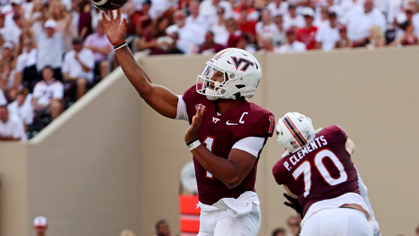 Sep 21, 2024; Blacksburg, Virginia, USA; Virginia Tech Hokies quarterback Kyron Drones (1) throws a pass during the third quarter against the Rutgers Scarlet Knights at Lane Stadium.