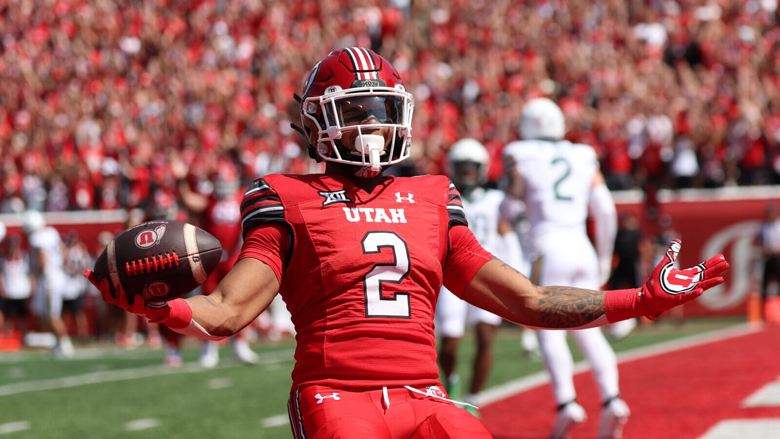 Sep 7, 2024; Salt Lake City, Utah, USA; Utah Utes running back Micah Bernard (2) celebrates a touchdown against the Baylor Bears during the first quarter at Rice-Eccles Stadium.