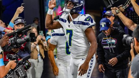 Seattle Seahawks quarterback Geno Smith (7) runs out onto the field during the pregame for the N.F.L. game between the Detroit Lions and the Seattle Seahawks at Ford Field in Detroit, Monday, Sept. 30, 2024.