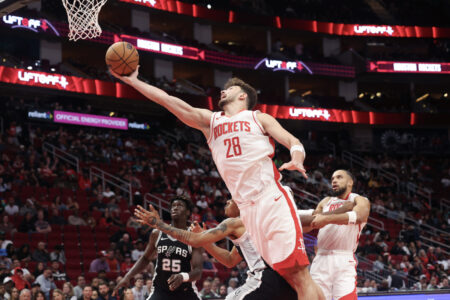 Oct 17, 2024; Houston, Texas, USA; Houston Rockets center Alperen Sengun (28) shoots against San Antonio Spurs guard Brandon Boston Jr. (4) in the fourth quarter at Toyota Center.
