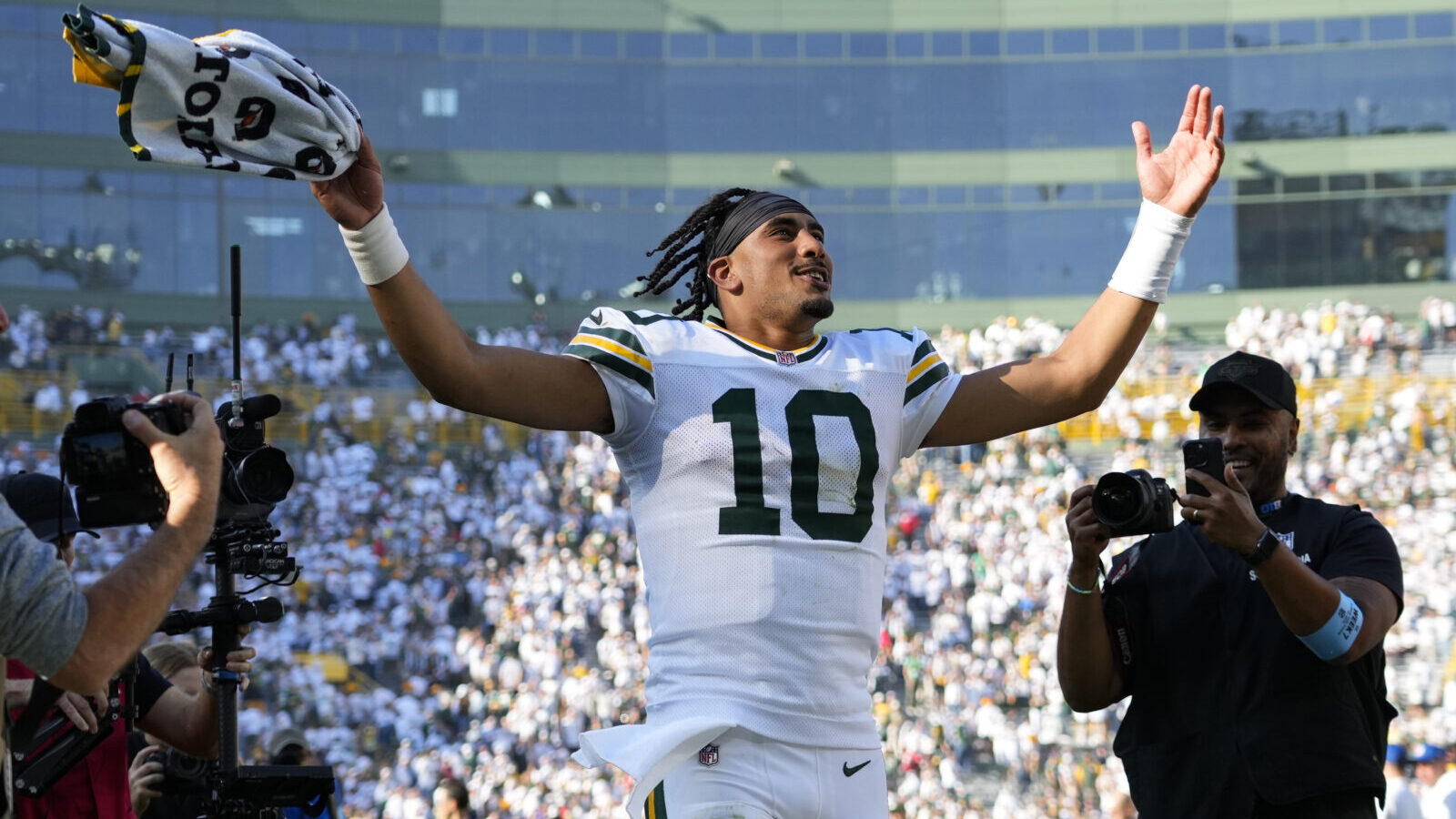 Oct 20, 2024; Green Bay, Wisconsin, USA; Green Bay Packers quarterback Jordan Love (10) celebrates as he runs off the field following the game against the Houston Texans at Lambeau Field.