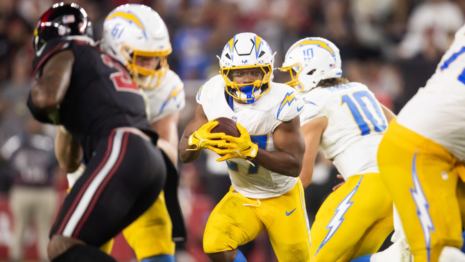 Oct 21, 2024; Glendale, Arizona, USA; Los Angeles Chargers running back J.K. Dobbins (27) against the Arizona Cardinals at State Farm Stadium.