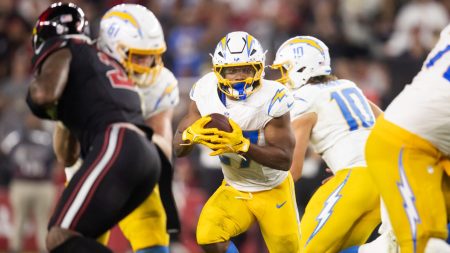 Oct 21, 2024; Glendale, Arizona, USA; Los Angeles Chargers running back J.K. Dobbins (27) against the Arizona Cardinals at State Farm Stadium.