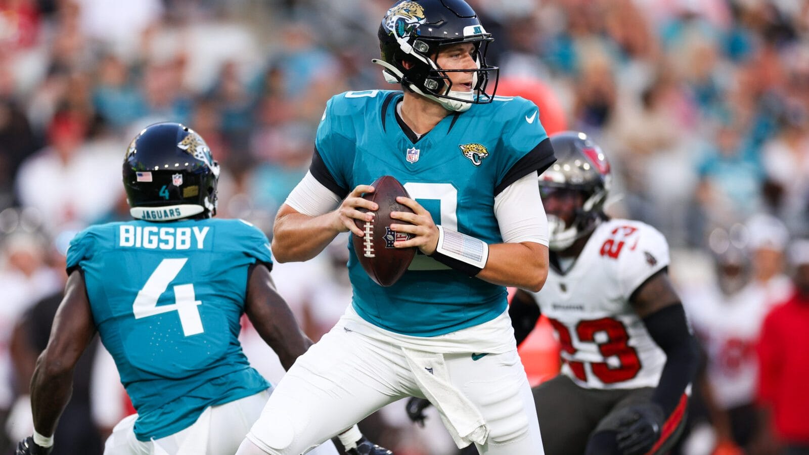 Aug 17, 2024; Jacksonville, Florida, USA; Jacksonville Jaguars quarterback Mac Jones (10) drops back to pass against the Tampa Bay Buccaneers in the first quarter during a preseason game at EverBank Stadium.