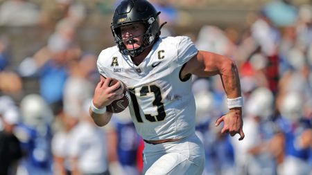 Oct 5, 2024; Tulsa, Oklahoma, USA; Army Black Knights quarterback Bryson Daily (13) runs for a touchdown against the Tulsa Golden Hurricane during the second half at Skelly Field at H.A. Chapman Stadium.