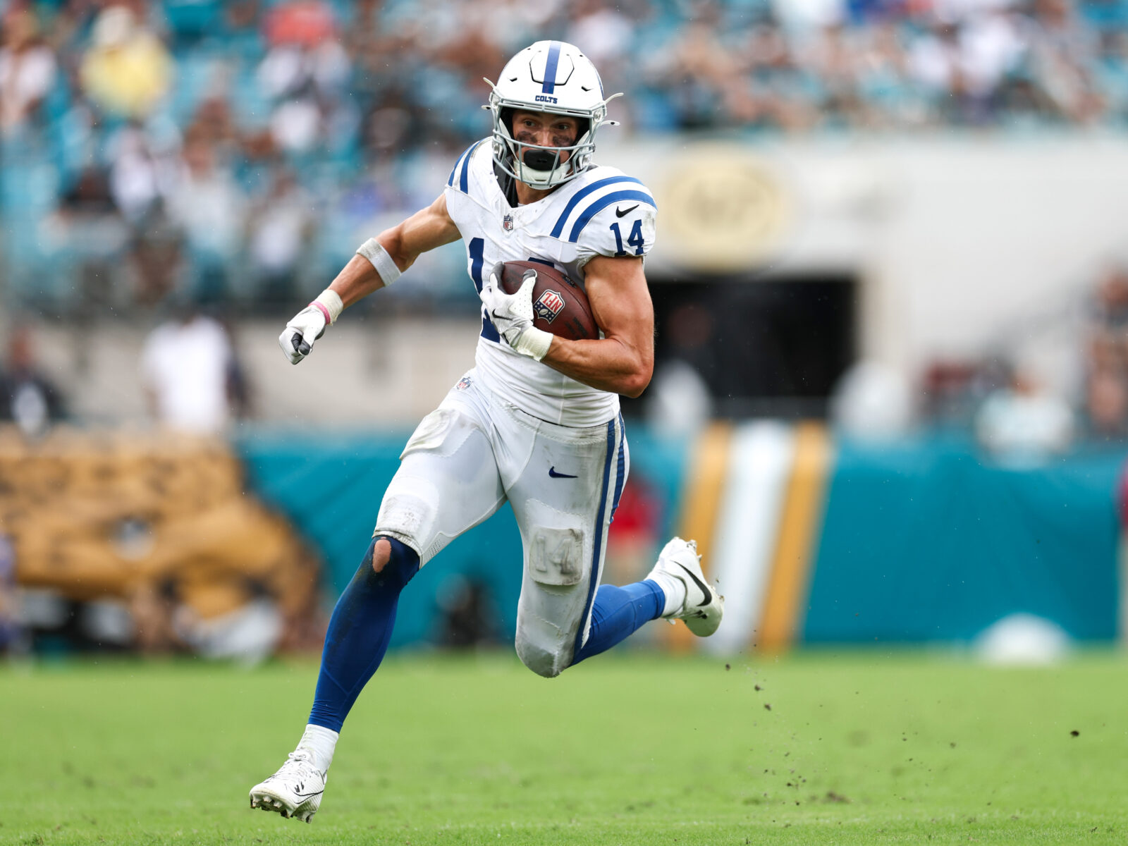 Oct 6, 2024; Jacksonville, Florida, USA; Indianapolis Colts wide receiver Alec Pierce (14) runs with the ball against the Jacksonville Jaguars in the fourth quarter at EverBank Stadium.