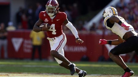 Oct 26, 2024; Tuscaloosa, Alabama, USA; Alabama Crimson Tide quarterback Jalen Milroe (4) scrambles around Missouri Tigers cornerback Toriano Pride Jr. (2) for a first down during the first half at Bryant-Denny Stadium.