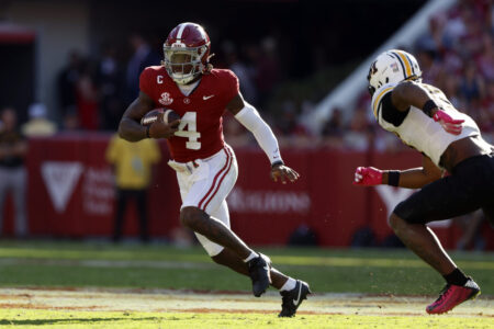 Oct 26, 2024; Tuscaloosa, Alabama, USA; Alabama Crimson Tide quarterback Jalen Milroe (4) scrambles around Missouri Tigers cornerback Toriano Pride Jr. (2) for a first down during the first half at Bryant-Denny Stadium.