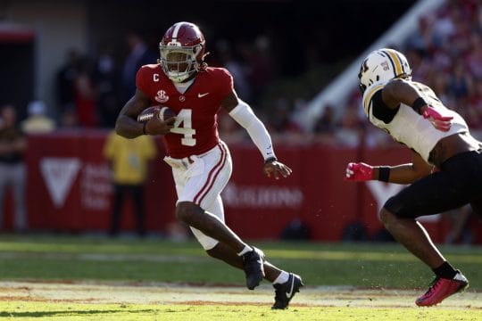 Oct 26, 2024; Tuscaloosa, Alabama, USA; Alabama Crimson Tide quarterback Jalen Milroe (4) scrambles around Missouri Tigers cornerback Toriano Pride Jr. (2) for a first down during the first half at Bryant-Denny Stadium.