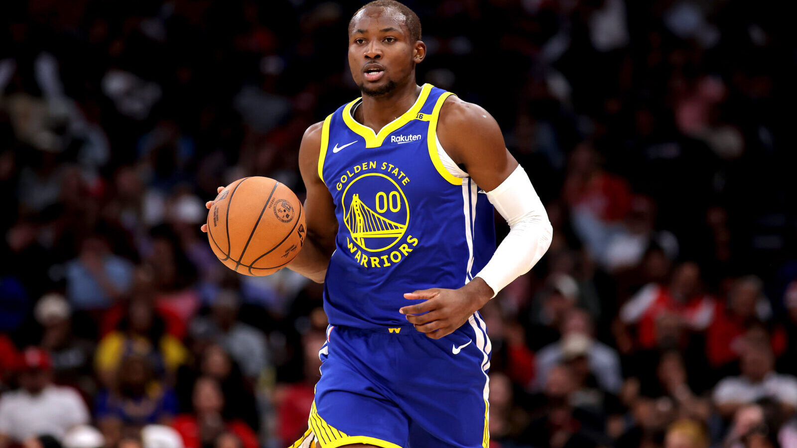 Nov 2, 2024; Houston, Texas, USA; Golden State Warriors forward Jonathan Kuminga (00) handles the ball against the Houston Rockets during the second quarter at Toyota Center.