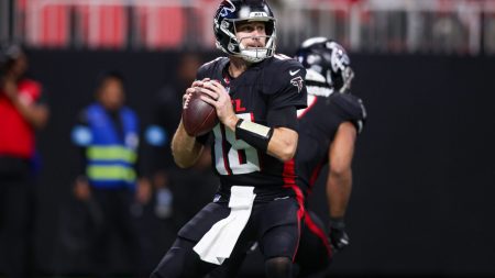 Dec 1, 2024; Atlanta, Georgia, USA; Atlanta Falcons quarterback Kirk Cousins (18) drops back to pass against the Los Angeles Chargers in the fourth quarter at Mercedes-Benz Stadium.
