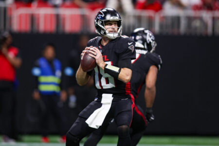 Dec 1, 2024; Atlanta, Georgia, USA; Atlanta Falcons quarterback Kirk Cousins (18) drops back to pass against the Los Angeles Chargers in the fourth quarter at Mercedes-Benz Stadium.