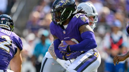 Sep 15, 2024; Baltimore, Maryland, USA; Baltimore Ravens running back Derrick Henry (22) runs during the second half against the Las Vegas Raiders at M&T Bank Stadium.