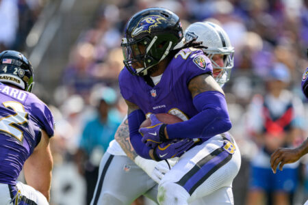 Sep 15, 2024; Baltimore, Maryland, USA; Baltimore Ravens running back Derrick Henry (22) runs during the second half against the Las Vegas Raiders at M&T Bank Stadium.