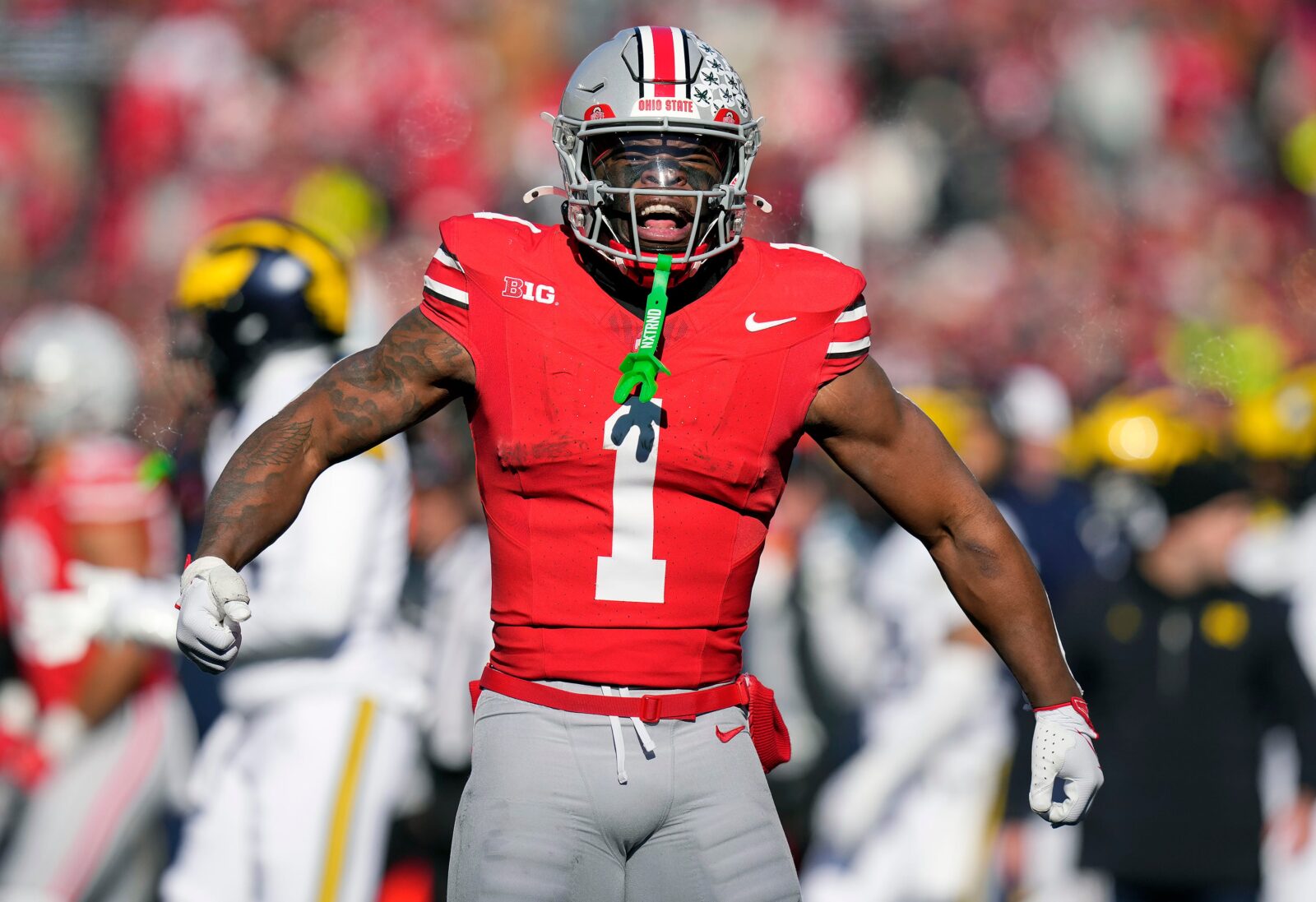 Ohio State Buckeyes running back Quinshon Judkins (1) celebrates after a first down run against Michigan Wolverines during the second quarter of the NCAA football game at Ohio Stadium in Columbus on Saturday, Nov. 30, 2024.