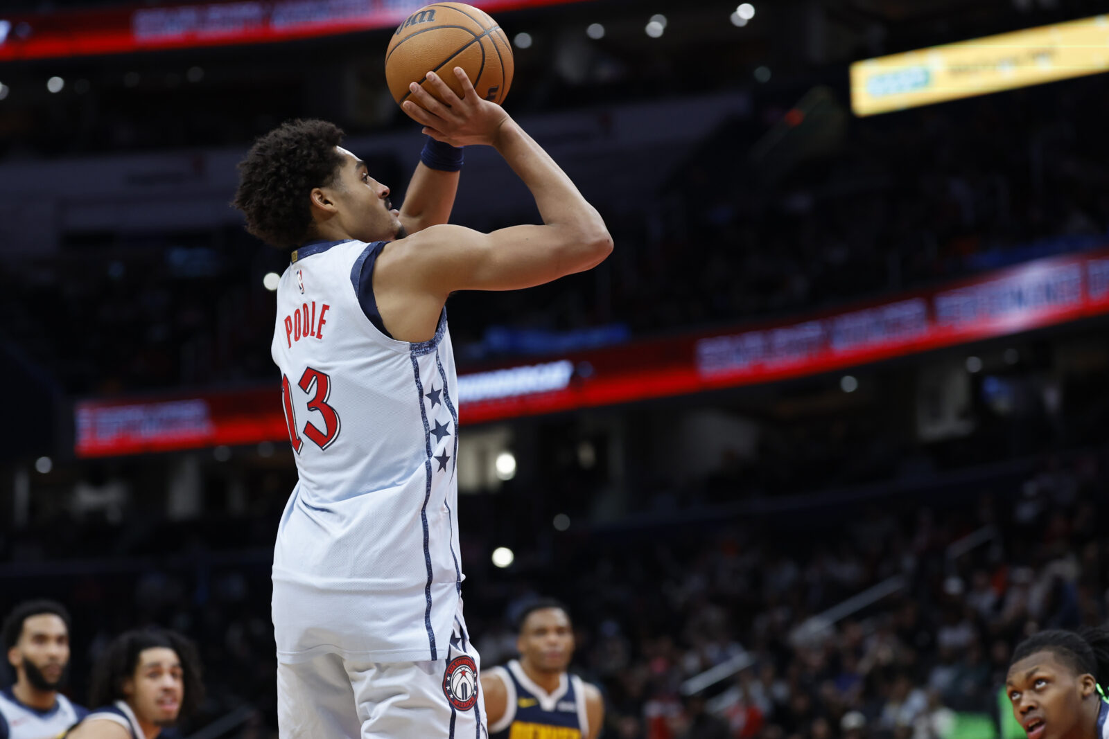 Dec 7, 2024; Washington, District of Columbia, USA; Washington Wizards guard Jordan Poole (13) shoots the ball against the Denver Nuggets in the fourth quarter at Capital One Arena.