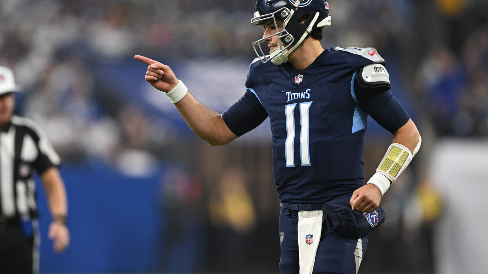 Dec 22, 2024; Indianapolis, Indiana, USA; Tennessee Titans quarterback Mason Rudolph (11) reacts to a touchdown during the first quarter against the Indianapolis Colts at Lucas Oil Stadium.