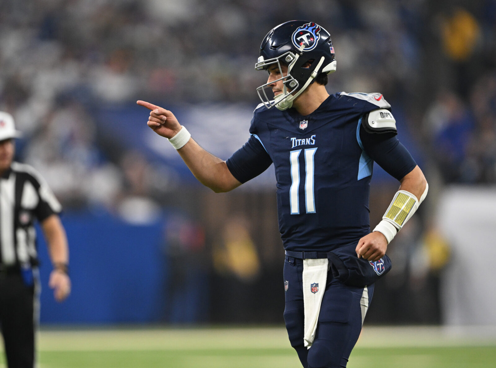 Dec 22, 2024; Indianapolis, Indiana, USA; Tennessee Titans quarterback Mason Rudolph (11) reacts to a touchdown during the first quarter against the Indianapolis Colts at Lucas Oil Stadium.