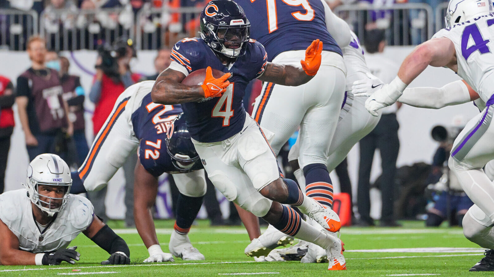 Dec 16, 2024; Minneapolis, Minnesota, USA; Chicago Bears running back D'Andre Swift (4) runs with the ball against the Minnesota Vikings in the third quarter at U.S. Bank Stadium.