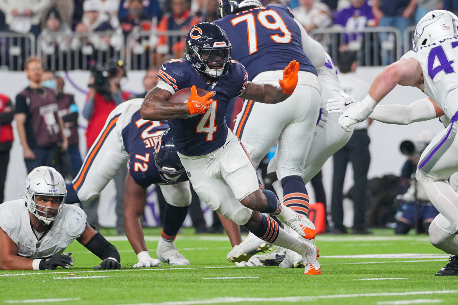 Dec 16, 2024; Minneapolis, Minnesota, USA; Chicago Bears running back D'Andre Swift (4) runs with the ball against the Minnesota Vikings in the third quarter at U.S. Bank Stadium.