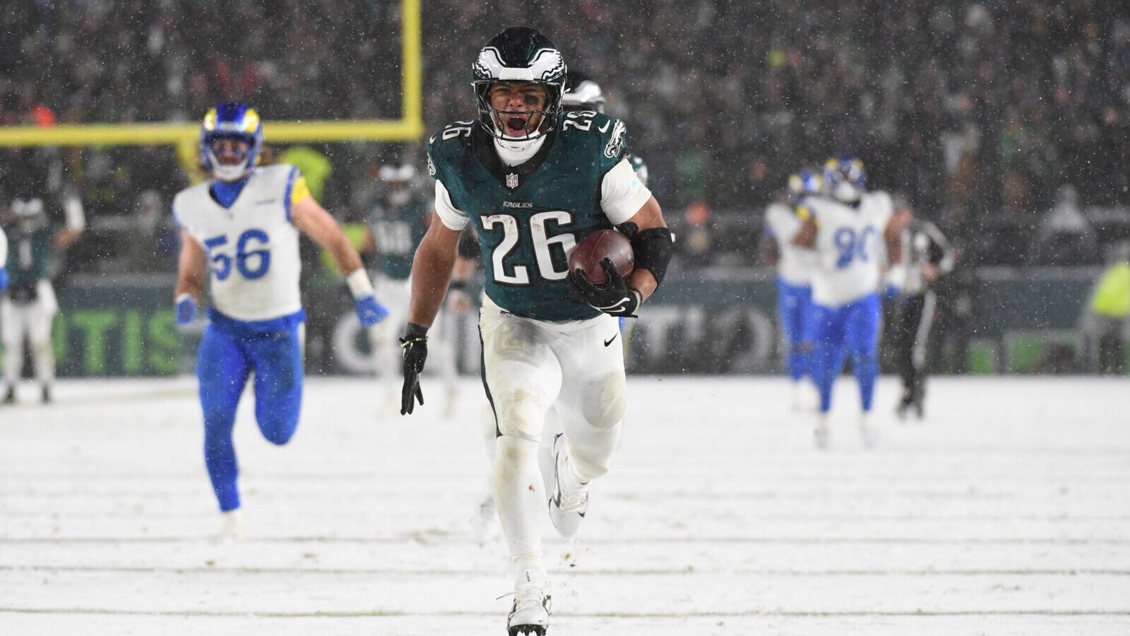 Jan 19, 2025; Philadelphia, Pennsylvania, USA; Philadelphia Eagles running back Saquon Barkley (26) carries the ball to score a touchdown against the Los Angeles Rams in the second half in a 2025 NFC divisional round game at Lincoln Financial Field.