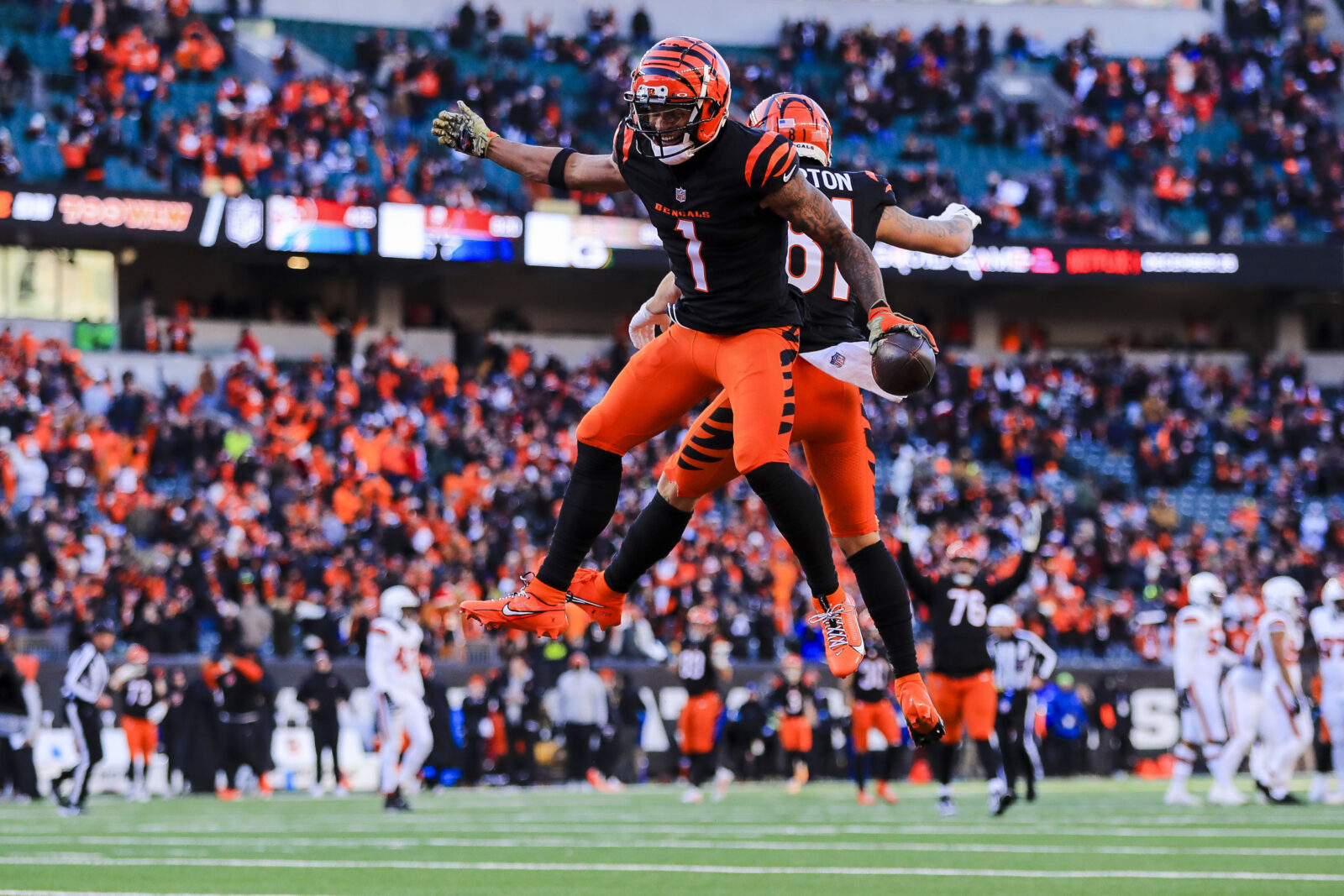Dec 22, 2024; Cincinnati, Ohio, USA; Cincinnati Bengals wide receiver Ja'Marr Chase (1) reacts with wide receiver Jermaine Burton (81) after scoring a touchdown in the second half against the Cleveland Browns at Paycor Stadium.