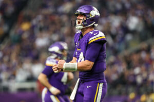 Dec 8, 2024; Minneapolis, Minnesota, USA; Minnesota Vikings quarterback Sam Darnold (14) celebrates his touchdown to wide receiver Jordan Addison (3) during the fourth quarter against the Atlanta Falcons at U.S. Bank Stadium.
