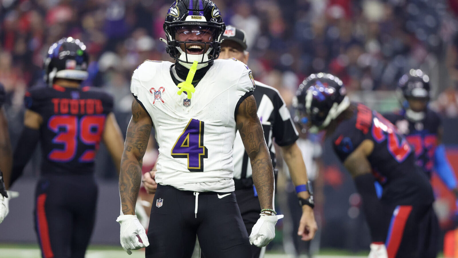 Dec 25, 2024; Houston, Texas, USA; Baltimore Ravens wide receiver Zay Flowers (4) reacts after his first down catch against the Houston Texans in the first quarter at NRG Stadium.