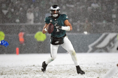Jan 19, 2025; Philadelphia, Pennsylvania, USA; Philadelphia Eagles quarterback Jalen Hurts (1) looks for a receiver during the fourth quarter against the Los Angeles Rams in a 2025 NFC divisional round game at Lincoln Financial Field.