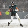 Jan 19, 2025; Philadelphia, Pennsylvania, USA; Philadelphia Eagles quarterback Jalen Hurts (1) looks for a receiver during the fourth quarter against the Los Angeles Rams in a 2025 NFC divisional round game at Lincoln Financial Field.