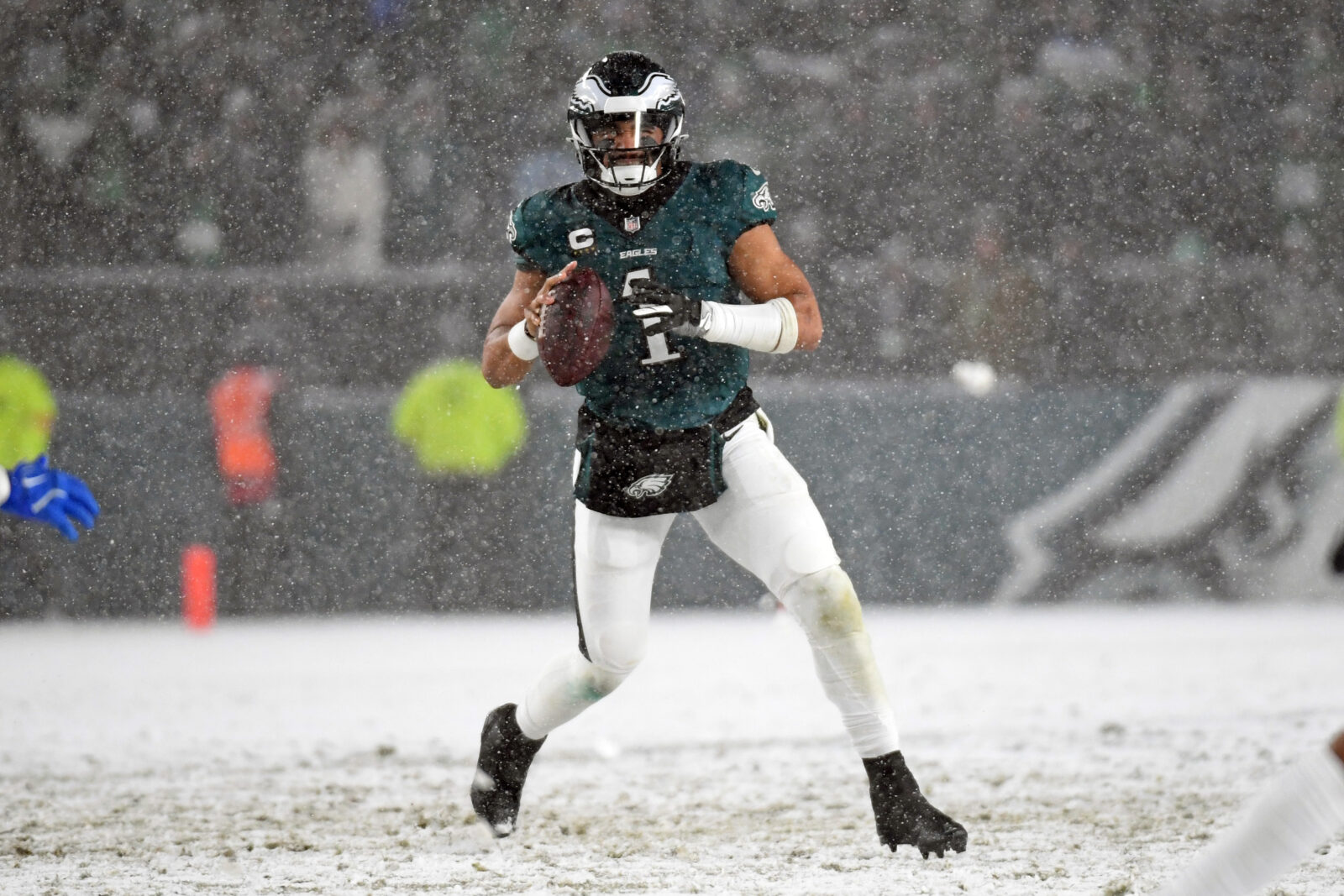 Jan 19, 2025; Philadelphia, Pennsylvania, USA; Philadelphia Eagles quarterback Jalen Hurts (1) looks for a receiver during the fourth quarter against the Los Angeles Rams in a 2025 NFC divisional round game at Lincoln Financial Field.