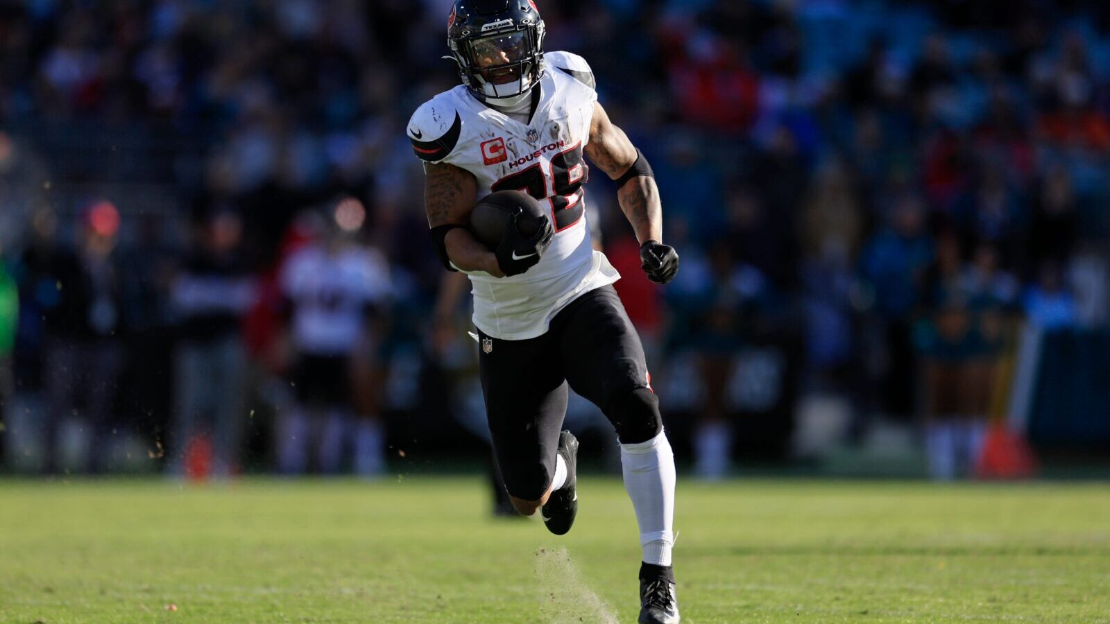 Houston Texans running back Joe Mixon (28) scores a touchdown during the third quarter of an NFL football matchup Sunday, Dec. 1, 2024 at EverBank Stadium in Jacksonville, Fla. The Texans held off the Jaguars 23-20.